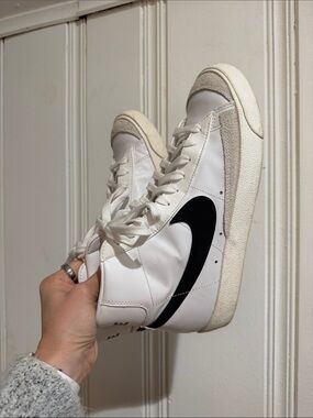 Nike White High-Top Sneakers with Black Swoosh